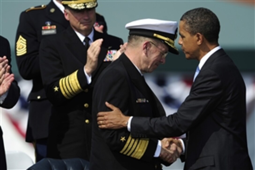 President Barack Obama congratulates Chairman of the Joint Chiefs of Staff Adm. Mike Mullen, U.S. Navy, during the chairman of the Joint Chiefs of Staff change of responsibility ceremony at Summerall Field, Joint Base Myer-Henderson Hall, Va., on Sept. 30, 2011. Mullen was succeeded by Army Gen. Martin E. Dempsey as the 18th chairman of the Joint Chiefs of Staff.  