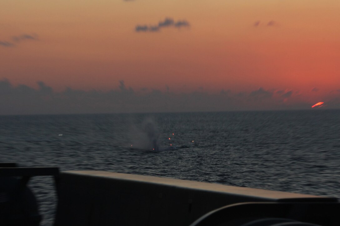 30mm Bushmaster II machine gun rounds impact the waters of the Mediterranean Sea during a display for Army Maj. Gen. David R. Hogg, U.S. Army Africa commanding general, aboard amphibious transport dock USS Mesa Verde (LPD 19), Oct. 3, 2011. Hogg toured Mesa Verde during a two-day visit and gave words of encouragement to Marines and Sailors. The Marines and sailors of the 22nd MEU are currently deployed with Amphibious Squadron 6 (PHIBRON 6) aboard the USS Bataan Amphibious Ready Group (BATARG) and will continue to train and improve the MEU’s ability to operate as a cohesive and effective Marine Air Ground Task Force.  The 22nd MEU is a multi-mission, capable force, comprised of an Aviation Combat Element, Marine Medium Tilt Rotor Squadron 263 (Reinforced)(VMM-263 (REIN)); a Logistics Combat Element, Combat Logistics Battalion 22(CLB 22); a Ground Combat Element, Battalion Landing Team, 2nd Battalion, 2nd Marine Regiment(BLT 2/2) and its Command Element.