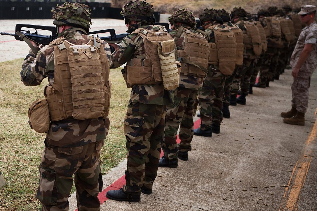 French airborne soldiers conduct combat marksmanship program training at a range here Oct. 4 during Exercise AMERCAL 2011. The purpose of the exercise was to enhance interoperability, improve military-to-military relations and sharpen warfighting skills through a combined training exchange with the NATO ally.