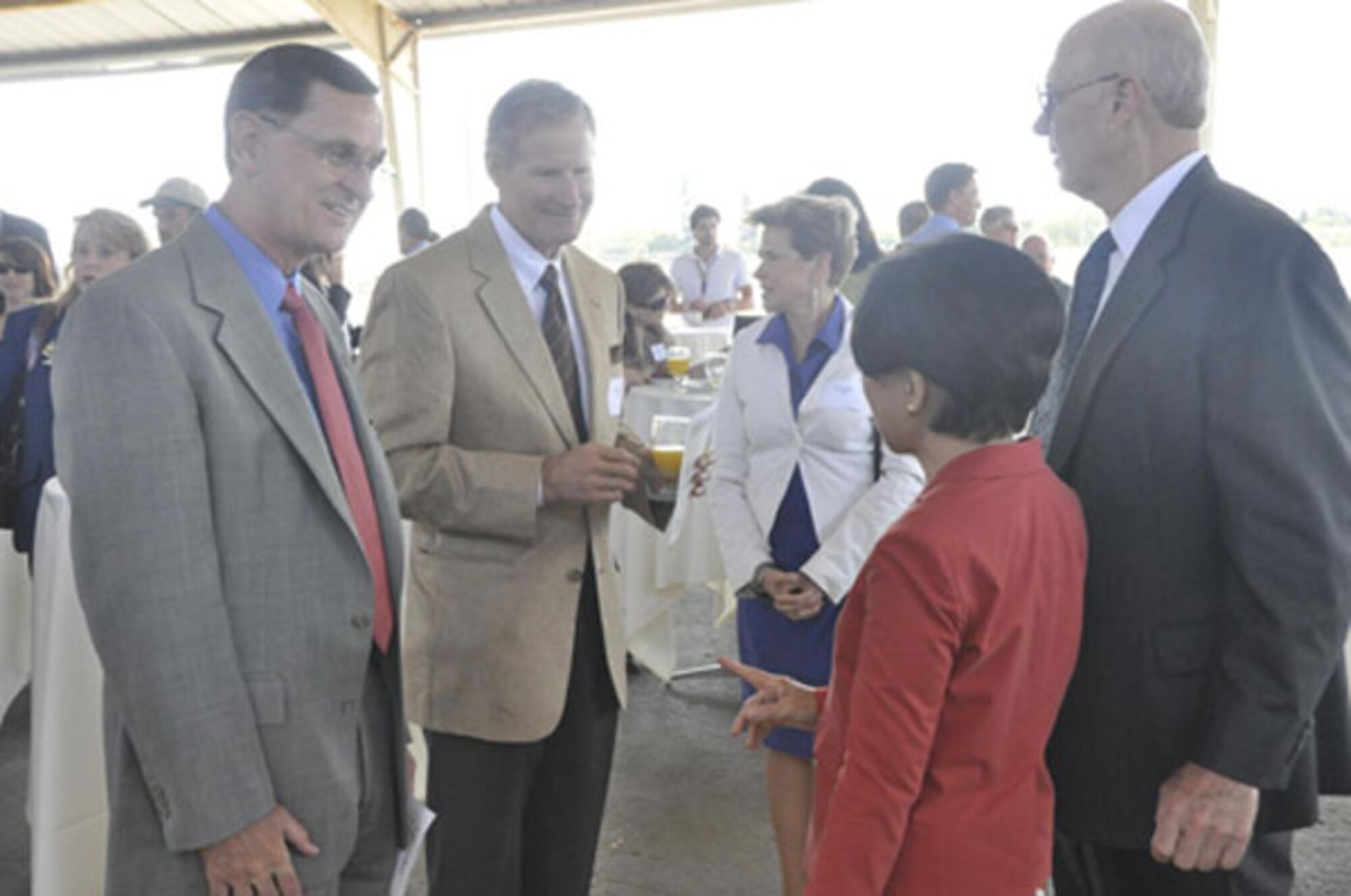 Steve TerMaath and Steve Mayer, Air Force Real Property Agency, talk with Congresswoman Doris Matsui and Larry Kelley, McClellan Business Park, at the cleanup event.