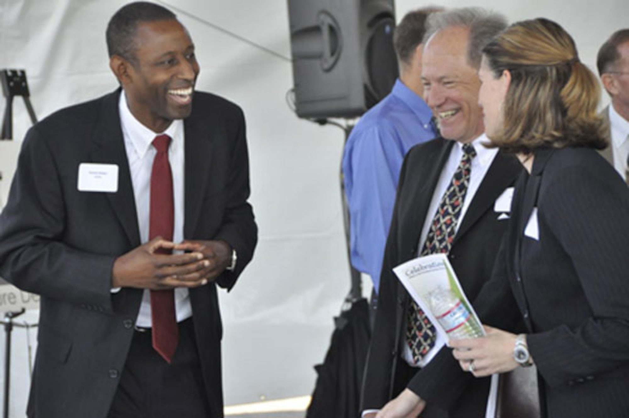 Mr Bridges, SAF/IEE talks with Phil Mook and Jennifer Miller, Air Force Real Property Agency, at the McClellan privatized cleanup celebration.