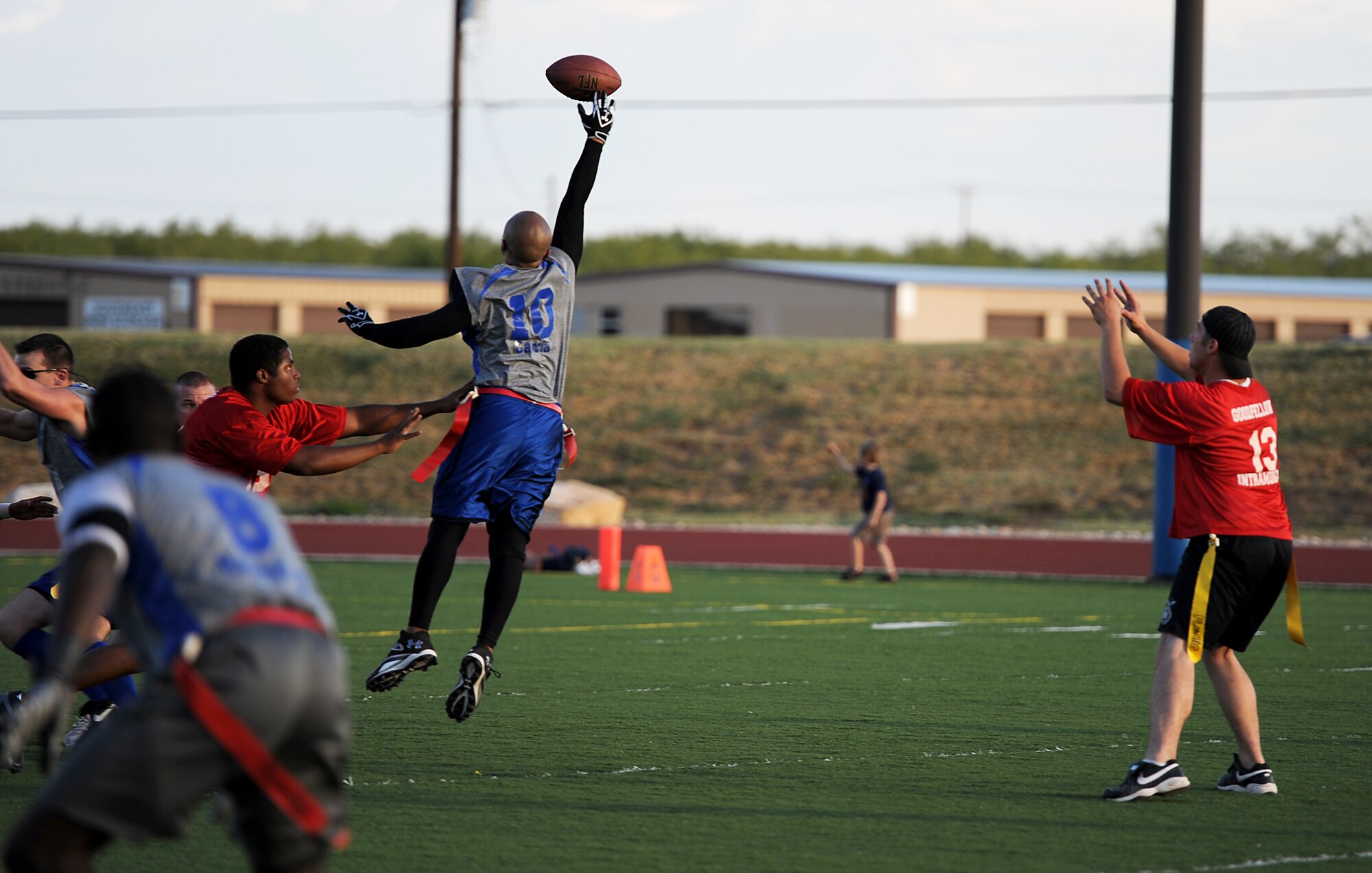 GOODFELLOW AIR FORCE BASE, Texas -- A member of the 316th Training Squadron Sharks intramural flag football team leaps into the air for an interception during a game against the 1st Responders Sept. 29. The Sharks defeated the 1st Responders, 18-7. (U.S. Air Force photo/Airman 1st Class Michael Smith)