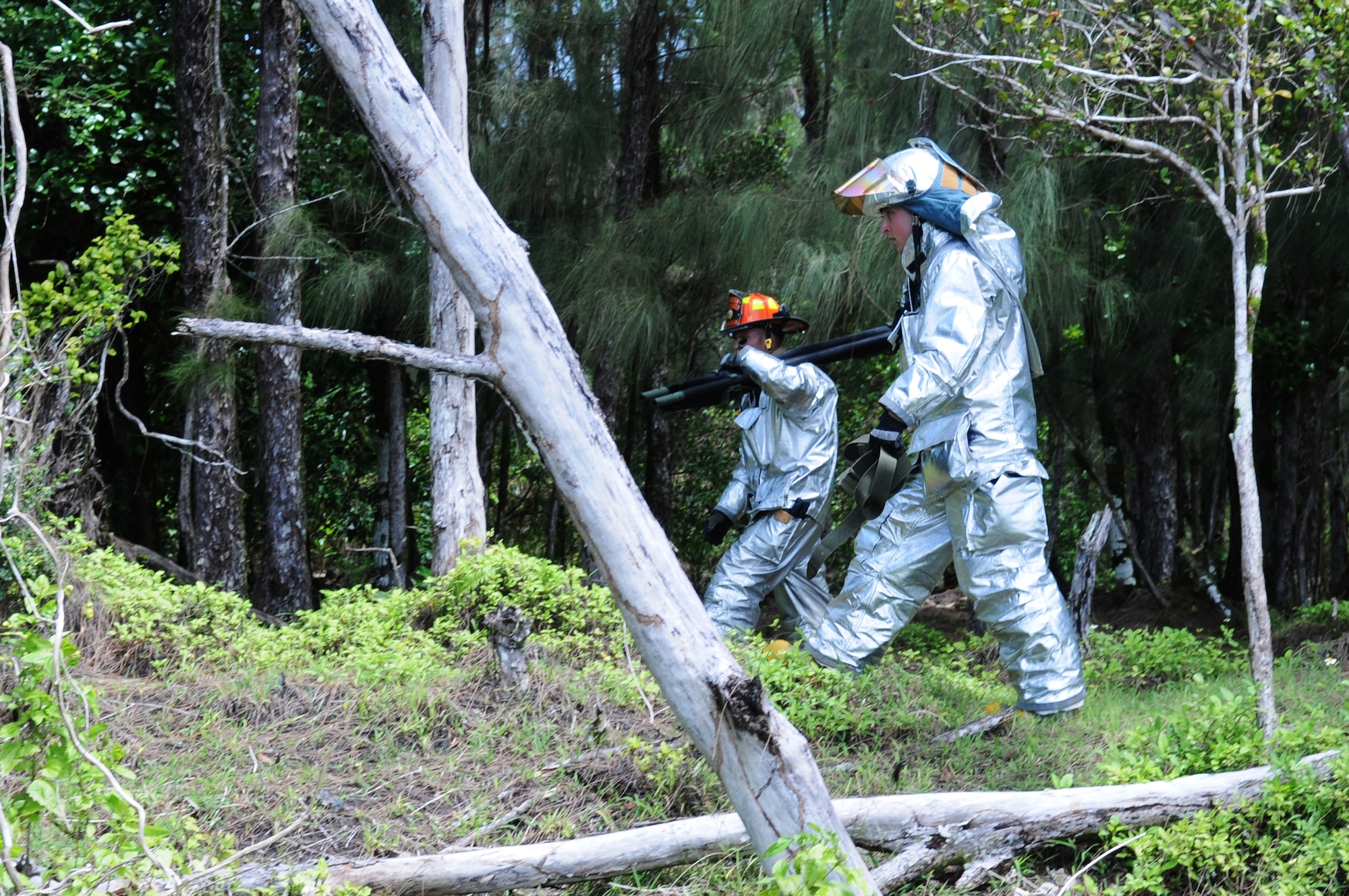ANDERSEN AIR FORCE BASE, Guam –– Firefighters from the 36th Civil Engineer squadron do an assessment on the damage and the first initial on scene walk through of the major accident exercise area, Oct. 3. The members will walk the full parameter and do a simulated assessment looking for any individuals dead or alive.(U.S. Air Force photo/ Senior Airman Carlin Leslie)