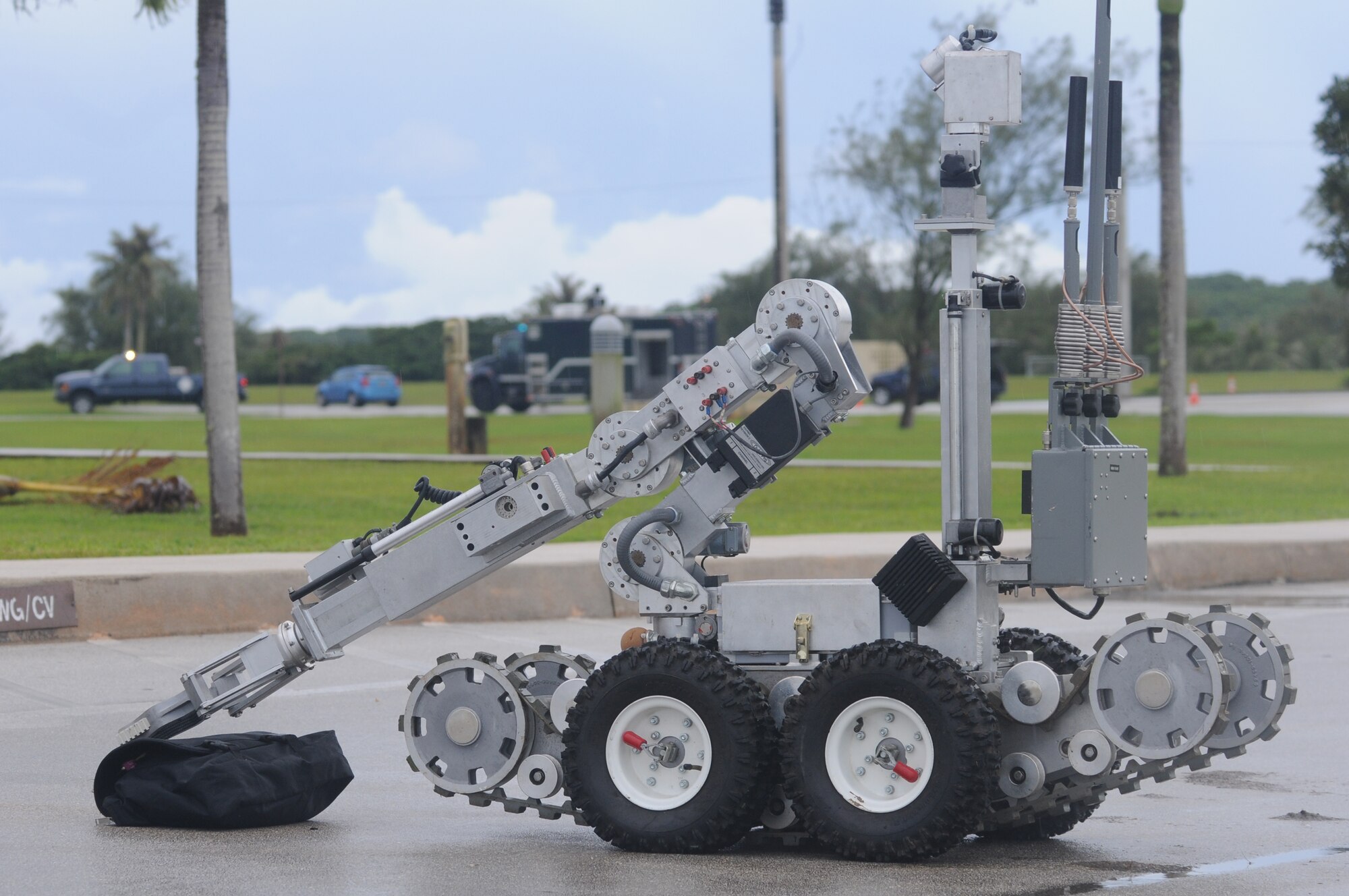 ANDERSEN AIR FORCE BASE, Guam – A REMOTEC F6A robot, operated by 36th Civil Engineer Squadron Explosive Ordnance Disposal Unit Airmen, relocates an exercise improvised explosive device, Oct. 3., during an Operational Readiness Exercise here. The robot is used to safely take suspicious packages to a safe location, away from buildings and personnel, in order to safely inspect it. (U.S. Air Force photo/ Senior Airman Carlin Leslie)