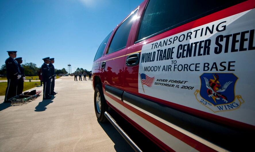 A sport utility vehicle sits in the middle of Moody’s heritage park after Paul Jockimo, a firefighter from Westchester, N.Y., delivers a piece of World Trade Center steel at Moody Air Force Base, Ga., Oct. 3, 2011. Jockimo, who has a history with Moody in helping set up critical response teams, drove 16 hours to transport the steel. When the opportunity to transport the steel presented itself, he was more than honored to show his appreciation for the military through the piece of history. (U.S. Air Force photo by Airman 1st Class Joshua Green/Released)   
