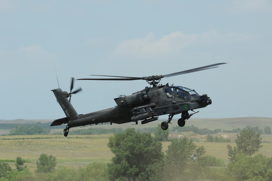 An AH-64 Apache performs maneuvers for the crowd at the 2011 Smoky Hill Open House.
