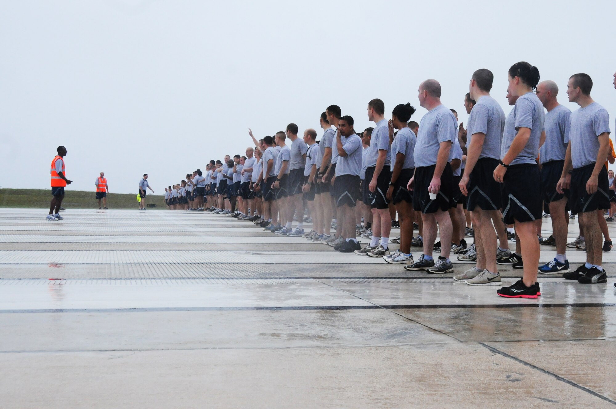 ANDERSEN AIR FORCE BASE, Guam – Members of Team Andersen line up to begin the foreign object debris walk here, Sept. 30. A FOD walk consists of taking members across the flightline to pick up any debris found on the runway or taxiways. (U.S. Air Force photo/ Senior Airman Carlin Leslie)