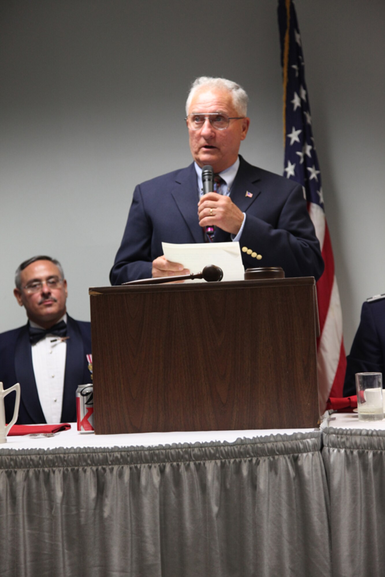 Senior Master Sgt. (retired) Charles E. Mathias delivers a speech at his 911 Hall of Fame induction ceremony as the Ceremonial Sergeant Major, 911 Airlift Wing Command Chief Master Sgt. John Payne, looks on, Oct. 1. (U.S. Air Force photo/Senior Airman Jonathan Hehnly)