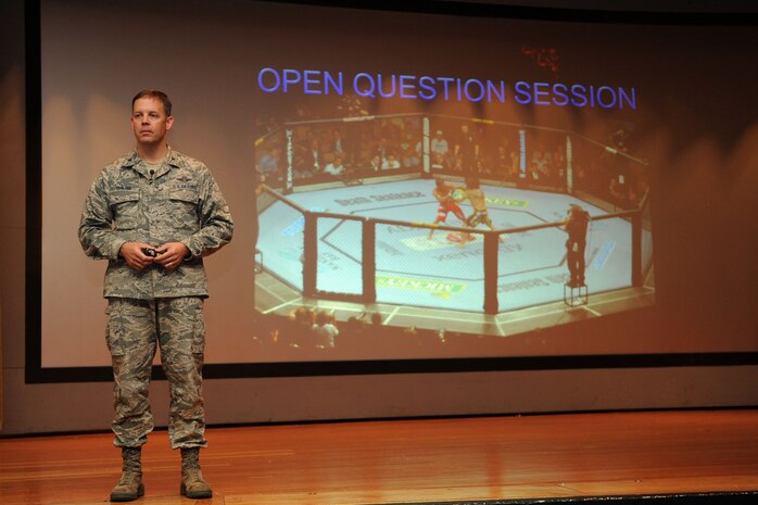 Col. Steven Garland, 99th Air Base Wing commander, hosts a town hall meeting for base housing residents to introduce the new Nellis Family Housing Utility Billing Program Sept. 29, 2011, in the base theater at Nellis Air Force Base, Nev. The town hall meeting was held to introduce and to answer questions about the utility billing program, which will begin in January 2012.  Under this new program, housing residents will receive a monthly utility allowance to assist in paying for their electric and gas usage at their individual homes, and they will incur charges if their usage costs rise above their allowance. (U.S. Air Force photo by Staff Sgt. Taylor Worley/Released)