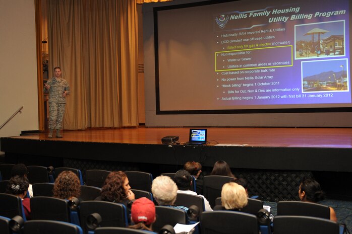 Col. Steven Garland, 99th Air Base Wing commander, hosts a town hall meeting for base housing residents to introduce the new Nellis Family Housing Utility Billing Program Sept. 29, 2011, in the base theater at Nellis Air Force Base, Nev. The town hall meeting was held to introduce and to answer questions about the utility billing program, which will begin in January 2012.  Under this new program, housing residents will receive a monthly utility allowance to assist in paying for their electric and gas usage at their individual homes, and they will incur charges if their usage costs rise above their allowance. (U.S. Air Force photo by Staff Sgt. Taylor Worley/Released)