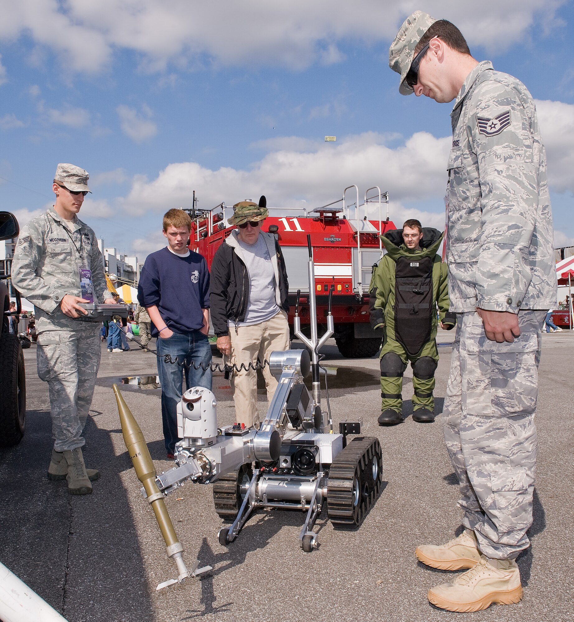 Explosive ordnance disposal members from the 436th Civil Engineer Squadron show race fans Rosie, a robot used to help EOD members dispose of unexploded ordnance Oct. 1, 2011, at Dover International Speedway in Dover, Del. Team Dover members participated in events throughout the weekend. (U.S. Air Force photo by Roland Balik)