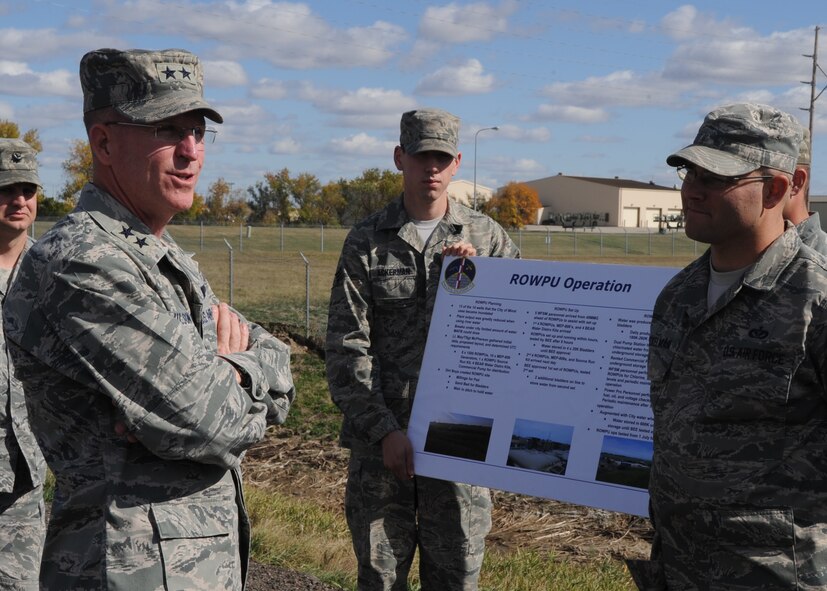 MINOT AIR FORCE BASE, N.D. – Maj. Gen. Stephen Wilson, 8th Air Force commander, speaks with the 5th Civil Engineer Squadron Airmen here, Sept. 29. Wilson thanked the Airmen for all the outstanding work they did for the 2011 Minot flood and spoke of how much the Minot community appreciated all that they did. Due to the outstanding work Airmen performed due to the 2011 Minot flood, Wilson came to Minot Air Force Base to see it first hand and to give additional words of encouragement. (U.S. Air Force photo/Senior Airman Ashley N. Avecilla)