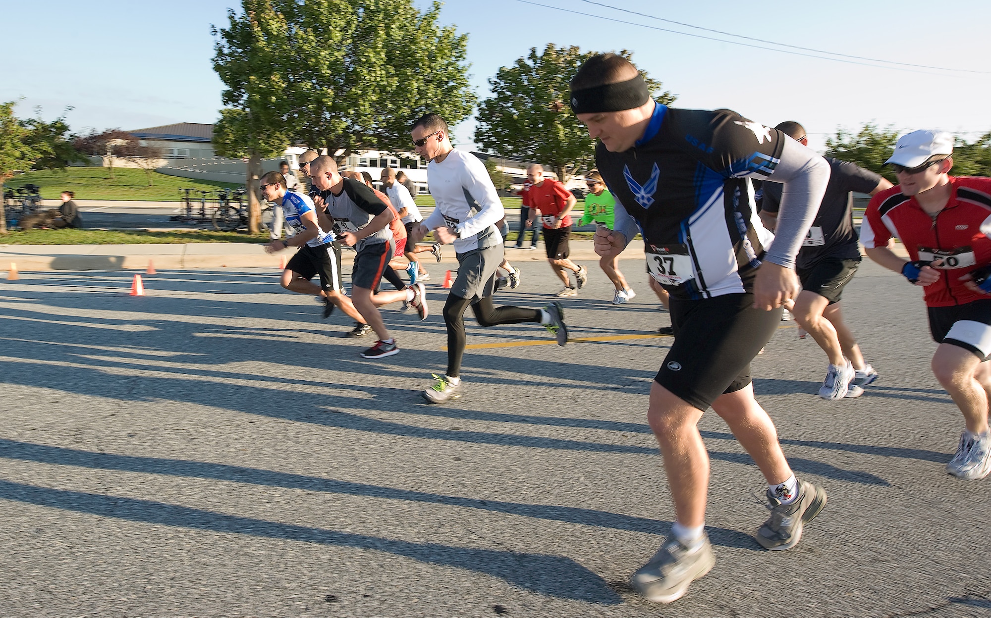 Participants in the Dover Air Force Base, Del., Duathlon race off the starting line Oct. 1, 2011. Seventeen participants covered more than 15 miles on foot and bicycle during the event. (U.S. Air Force photo by Airman 1st Class Samuel Taylor)