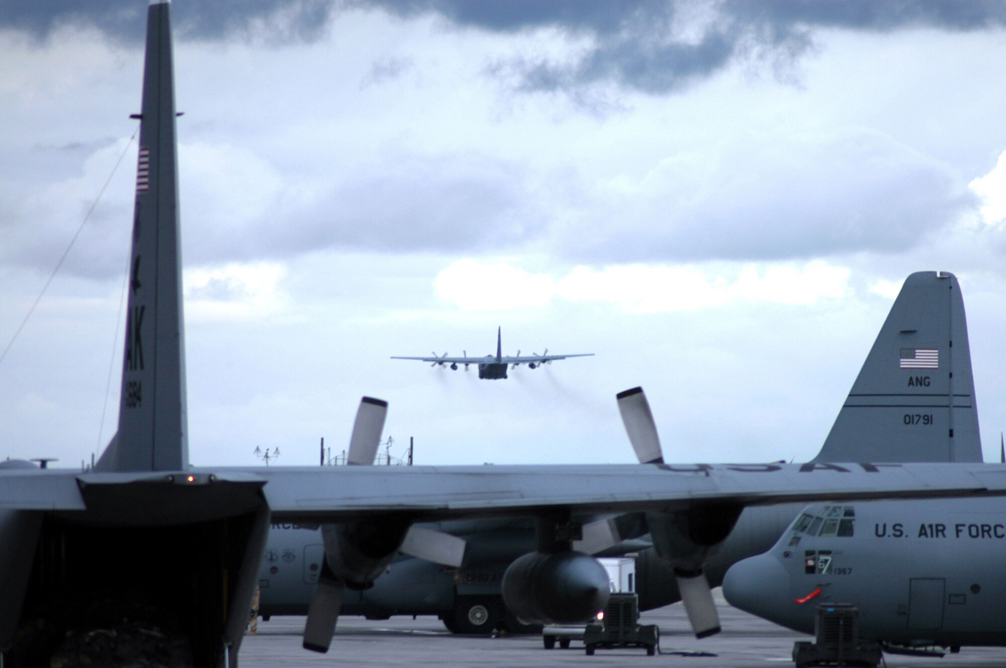 A C-130 Hercules ctakes off for an Operation Enduring Freedom mission on a cloudy afternoon at Karshi-Khanabad Air Base, Uzbekistan, on March 26, 2005. (U.S. Air Force Photo/Master Sgt. Scott T. Sturkol) 