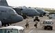 C-130 Hercules aircrew members board their aircraft for an Operation Enduring Freedom mission at Karshi-Khanabad Air Base, Uzbekistan, on April 19, 2005. (U.S. Air Force Photo/Master Sgt. Scott T. Sturkol)