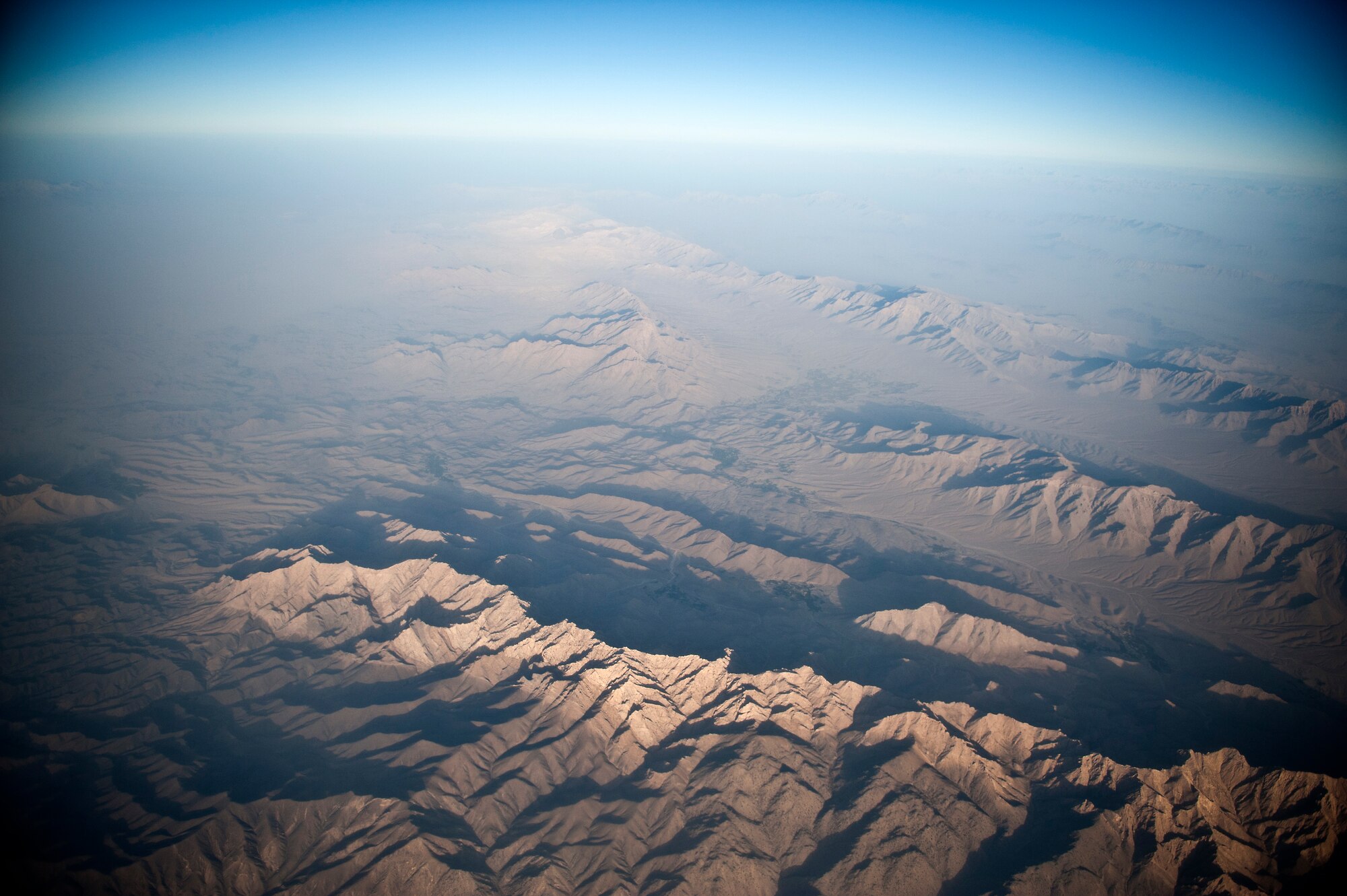 The mountainous landscape of Southern Afghanistan makes resupplying troops on the ground a logistical challenge. U.S. Air Force Airmen help overcome the challenge by dropping supplies from aircraft to some of the military's most remote outposts. (U.S. Air Force Photo/Master Sgt. Jeffrey Allen)