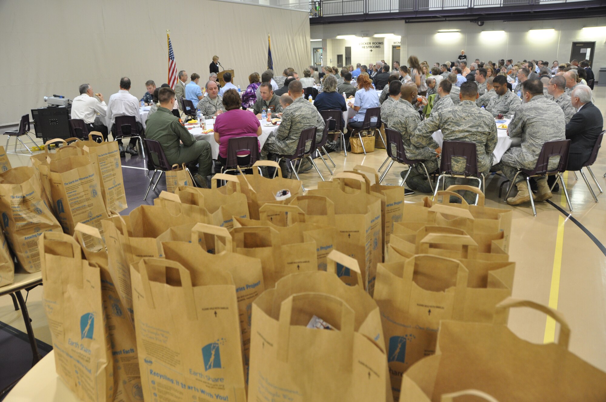 Patrons listen to campaign instructions during the Combined Federal Campaign kick-off breakfast at the Lied Activity Center, Bellevue Neb., Sept. 22. The CFC runs through the end of December and allows military, federal and postal employees to donate to local, national and international charities of their choice. (U.S. Air Force photo by Jeff W. Gates/Released)
