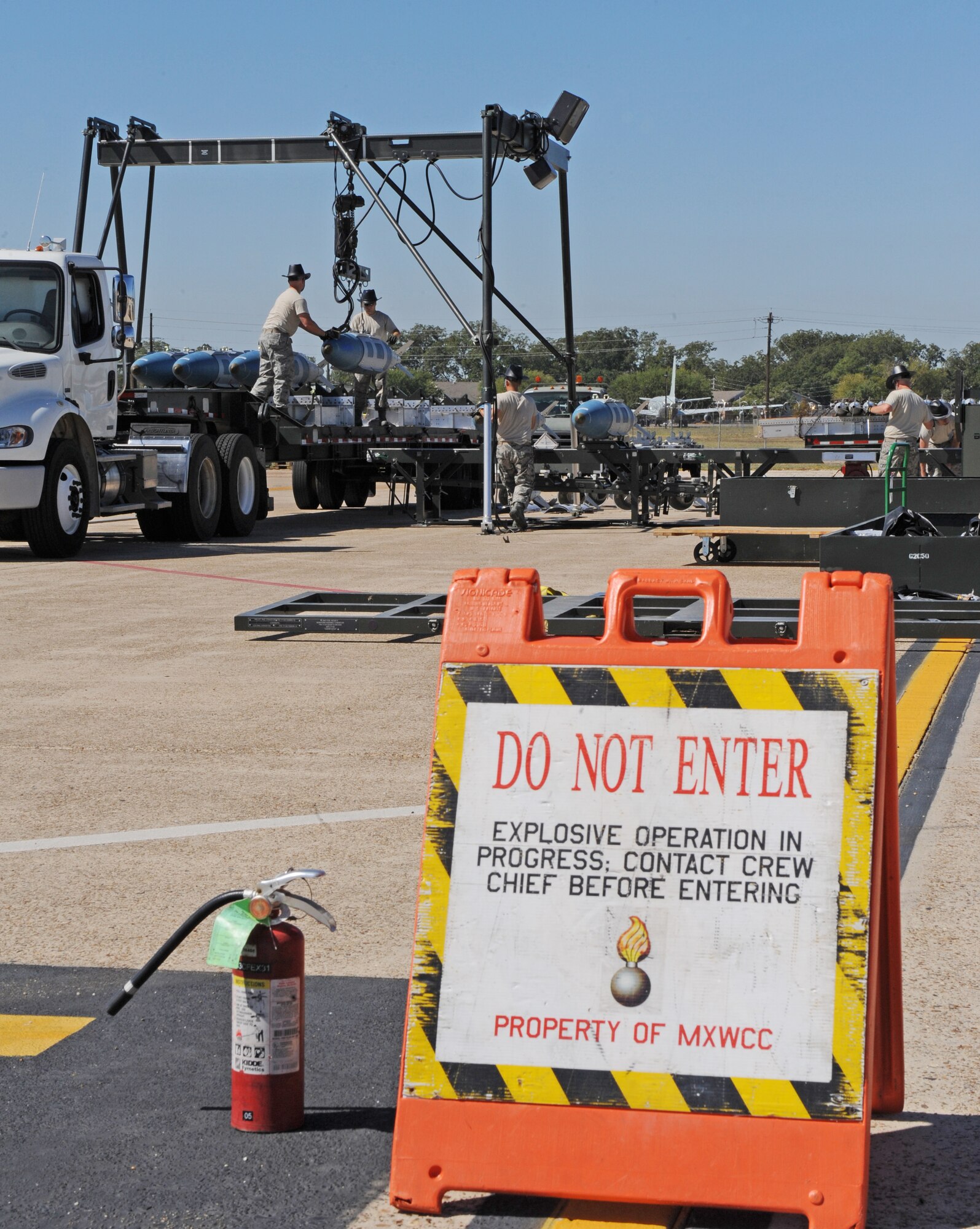 Airmen from the 2nd Munitions Squadron load an inert 2000-pound bomb onto a trailer during the Global Strike Challenge Munitions Maintenance Competition on Barksdale Air Force Base, La., Oct. 3. Global Strike Challenge is the world's premier bomber, Intercontinental Ballistic Missile and security forces competition with units from Air Force Global Strike Command, Air Combat Command, Air Force Reserve Command and the Air National Guard. (U.S. Air Force photo/Airman 1st Class Micaiah Anthony)(RELEASED)