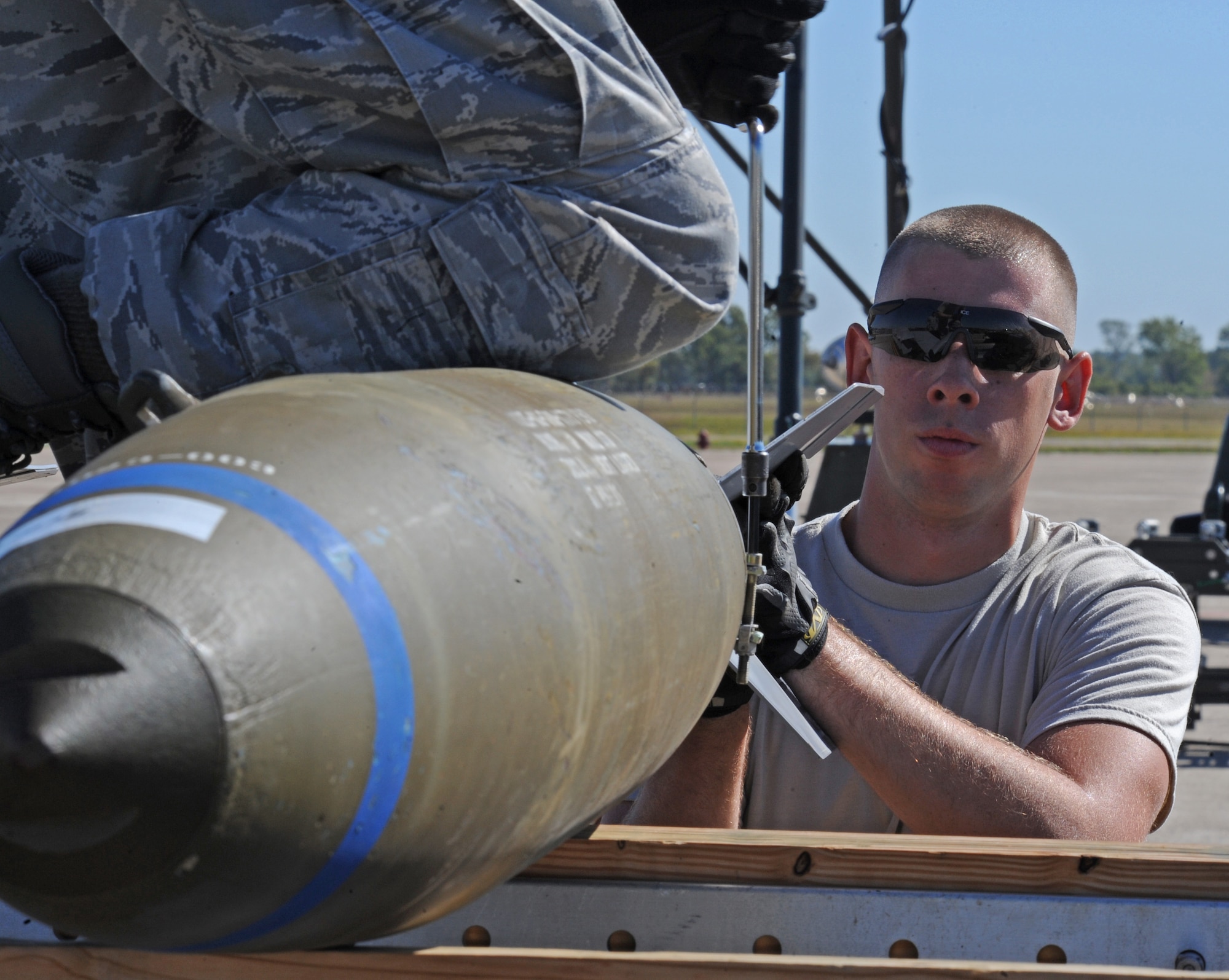 Airmen from the 2nd Munitions Squadron attach the tail section of a 500-pound bomb during the Global Strike Challenge Munitions Maintenance Competition on Barksdale Air Force Base, La., Oct. 3. The goal of the competition is to increase morale, teamwork and readiness. (U.S. Air Force photo/Airman 1st Class Micaiah Anthony)(RELEASED)
