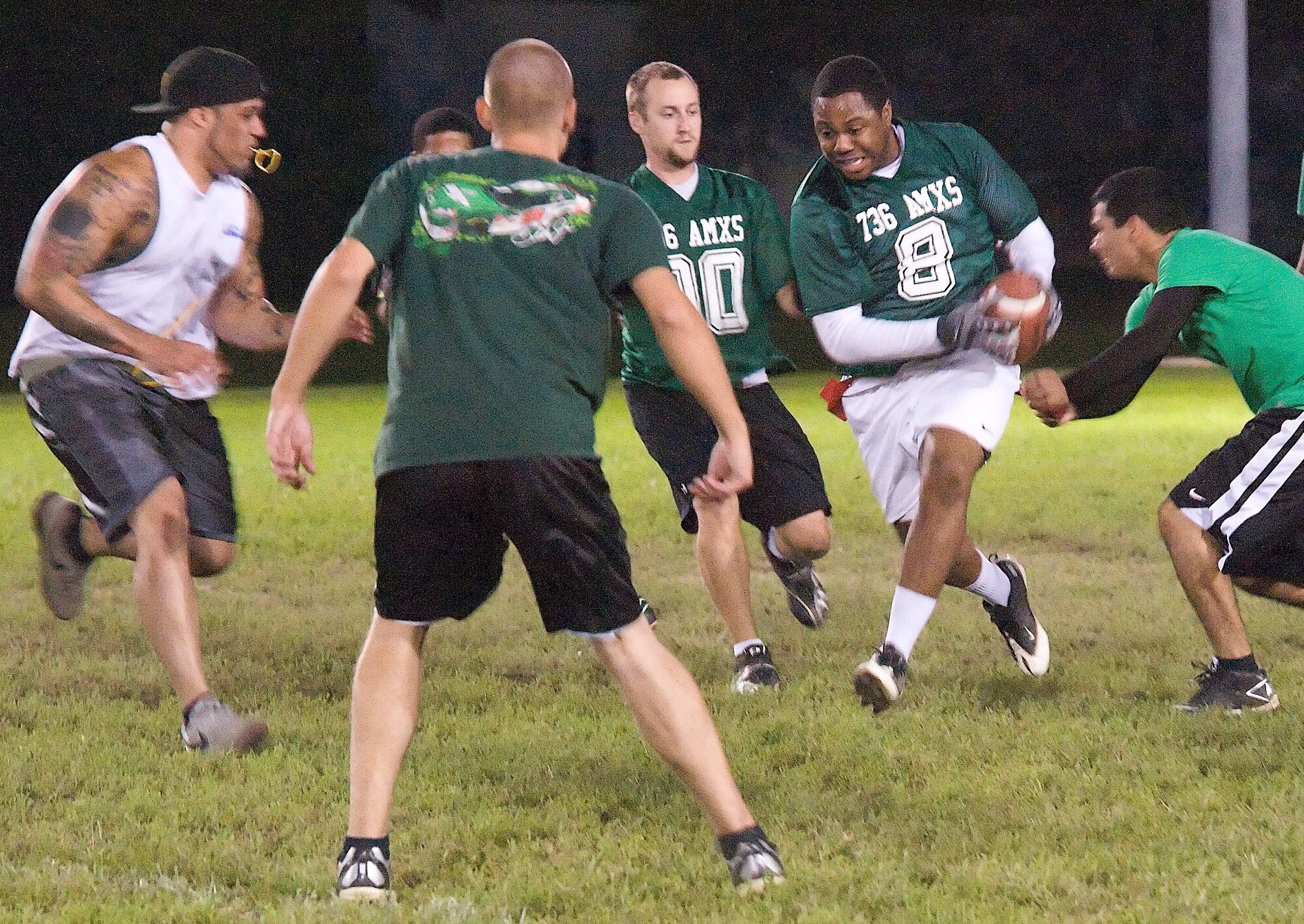 736th Aircraft Maintenance Squadron members converge on Andre Leonard during a practice game Oct. 29 at Dover Air Force Base, Del. The 736th coach, Jason Jones, said this practice match will help prepare his team for their upcoming match against their rival, the 436th Aircraft Maintenance Squadron. (U.S. Air Force photo by Airman 1st Class Samuel Taylor)