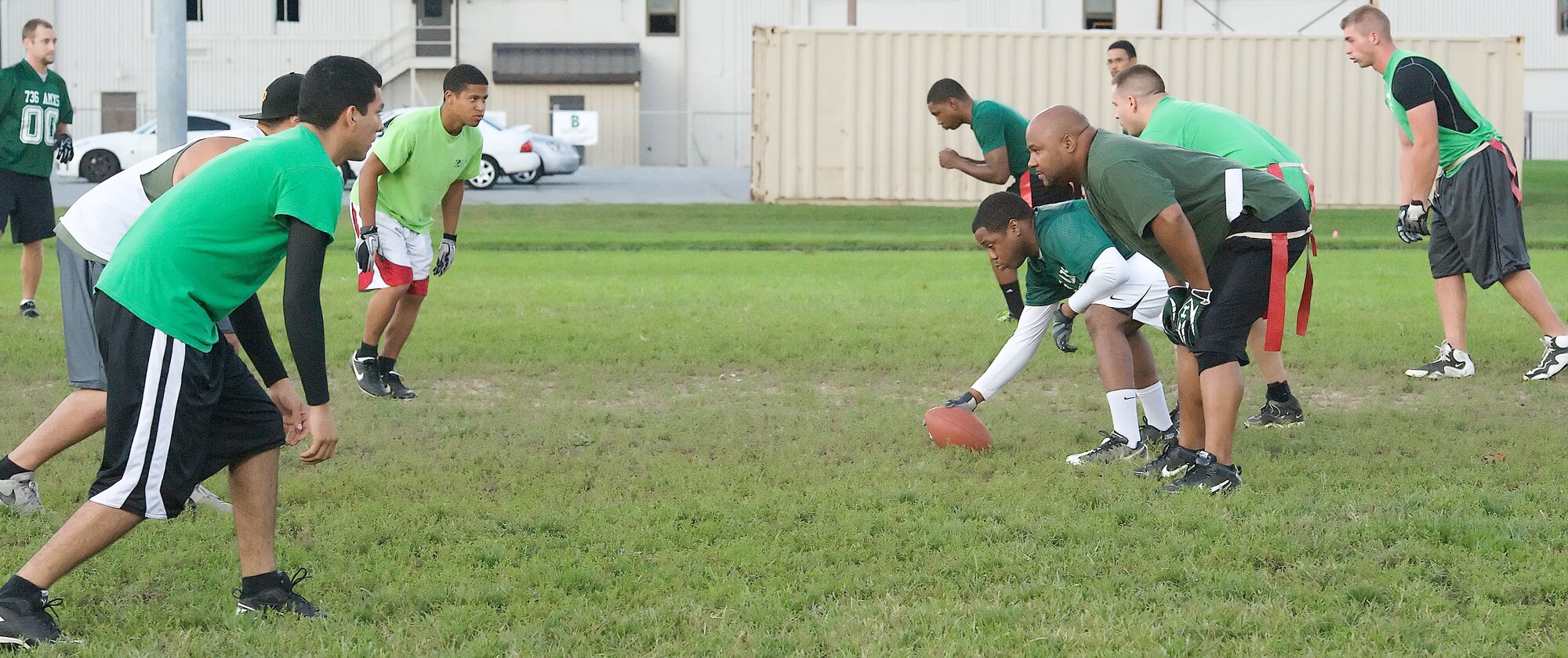 736th Aircraft Maintenance Squadron members square off at the line of scrimmage during a practice game Oct. 29 at Dover Air Force Base, Del. The 736th coach, Jason Jones, said this practice match will help prepare his team for their upcoming match against their rival, the 436th Aircraft Maintenance Squadron. (U.S. Air Force photo by Airman 1st Class Samuel Taylor)
