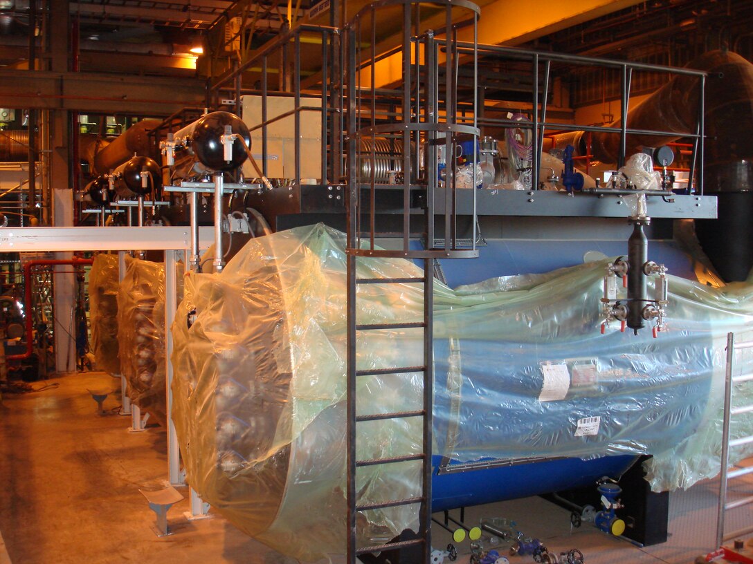 New exhaust boilers at Thule Air Base take the excess heat from the electrical generators and use it to heat the base. The new boilers will save the base $3 million a year and 1.5 million gallons of fuel. Once all five exhaust boilers are functioning, the current heating plant will provide backup heating, a vital piece to combat the extreme cold 700 miles north of the Arctic Circle. (Courtesy photo) 