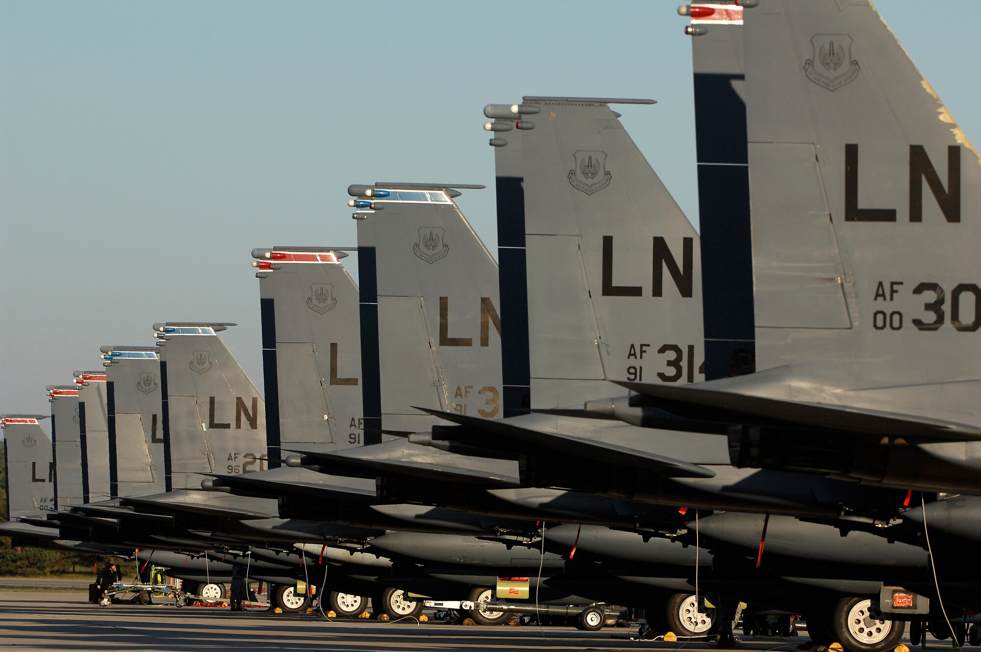 ROYAL AIR FORCE LAKENHEATH, England - A group of F-15E Strike Eagles standby for maintenance after a deployment Sept. 30, 2011.  Members of the 48th Fighter Wing and families greeted Airmen of the 494th Fighter Squadron who returned from deployment to Kunsan Air Base, South Korea where they supported the 8th FW's mission. (U.S.  photo by Tech. Sgt. Lee A. Osberry Jr.)