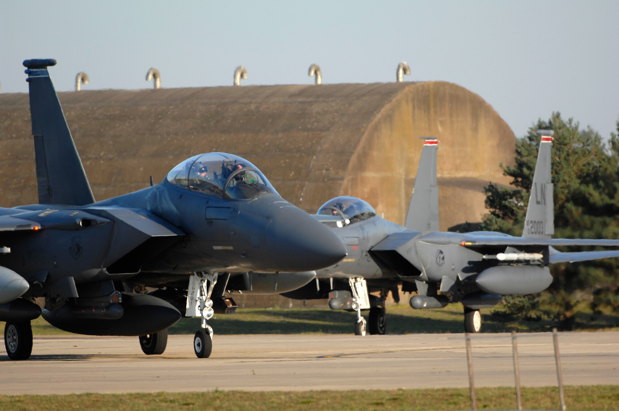 ROYAL AIR FORCE LAKENHEATH, England - A group of F-15E Strike Eagles taxi to their parking spots after a deployment Sept. 30, 2011.  Members of the 48th Fighter Wing and families greeted Airmen of the 494th Fighter Squadron who returned from deployment to Kunsan Air Base, South Korea where they supported the 8th FW's mission. (U.S.  photo by Tech. Sgt. Lee A. Osberry Jr.)