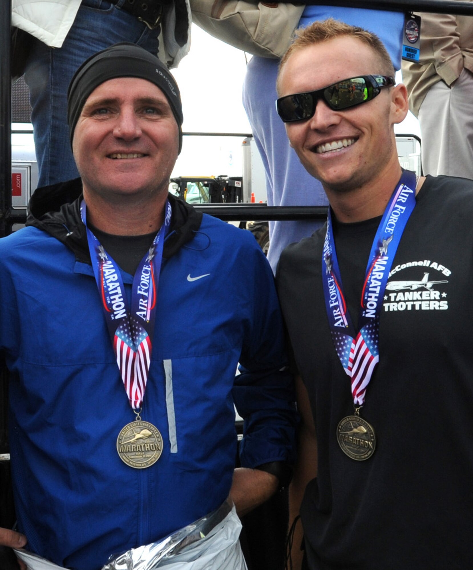 Chief Master Sgt. Michael Edwards, 22nd Air Refueling Wing command chief, left, and Airman 1st Class Devon Thomas, 22nd Aircraft Maintenance Squadron crew chief, pose after finishing the half marathon race at the Air Force Marathon Sept. 17, 2011, Wright-Patterson Air Force Base, Ohio. The two runners were among more than 13,000 runners who competed in the 15th annual event. (U.S. Air Force photo by Airman 1st Class Laura L. Valentine)