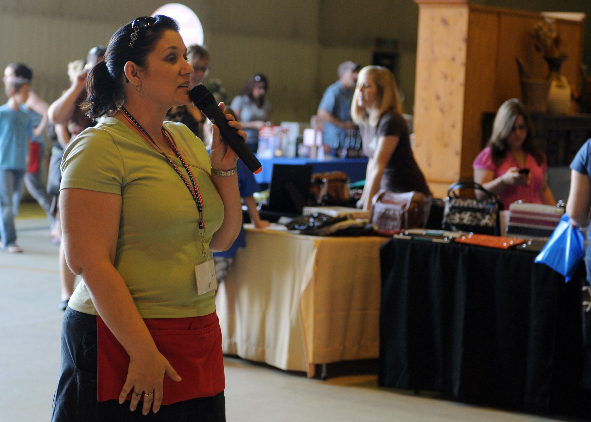 RAF LAKENHEATH, England – Jennifer Berning, bazaar advisor, gives an announcement during the Holiday Bazaar at RAF Lakenheath Oct. 2, 2011. Throughout the year, RAFs Mildenhall and Lakenheath each hold two bazaars which give base members an opportunity to browse vendor’s items from throughout the United Kingdom and Europe.  The Yuletide Bazaar will be held next at RAF Mildenhall in November.  (U.S. Air Force photo by Staff Sgt. Tabitha M. Lee)