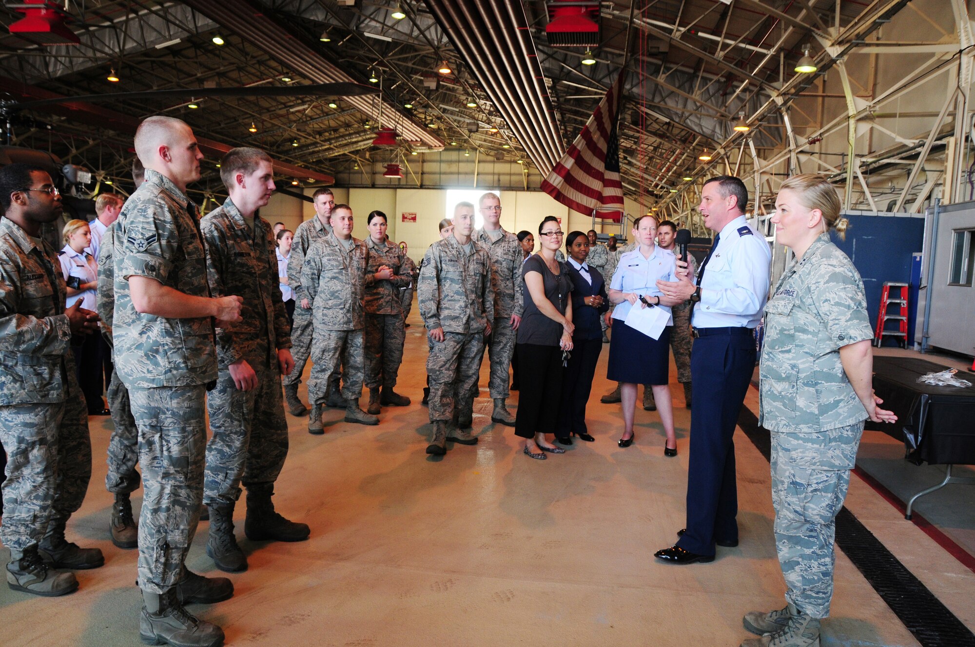 ROYAL AIR FORCE LAKENHEATH, England -- Col. William Lewis, 48th Fighter Wing vice commander, speaks to Liberty Airmen during the Combined Federal Campaign kick-off at Hangar 7 on Oct. 3, 2011. This year is the 50th anniversary of the CFC, established in 1961 to support and promote charities through volunteers. (U.S. Air Force photo by Senior Airman Lausanne Morgan)