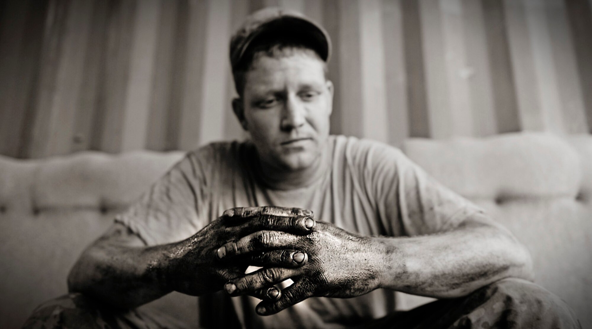 Staff Sgt. Tim Husketh, from Clarksville, Tenn., vehicle mechanic deployed out of Ramstein Air Base, Germany and attached to Laghman Provincial Reconstruction Team takes a break at the end of a long day Aug. 20, 2011. The Air Force mechanics work around the clock, to ensure all vehicles assigned to the PRT are at 100 percent mission capable status so the PRT can roll out at a moments notice. (U.S. Air Force photo/ Staff Sgt. Ryan Crane)
