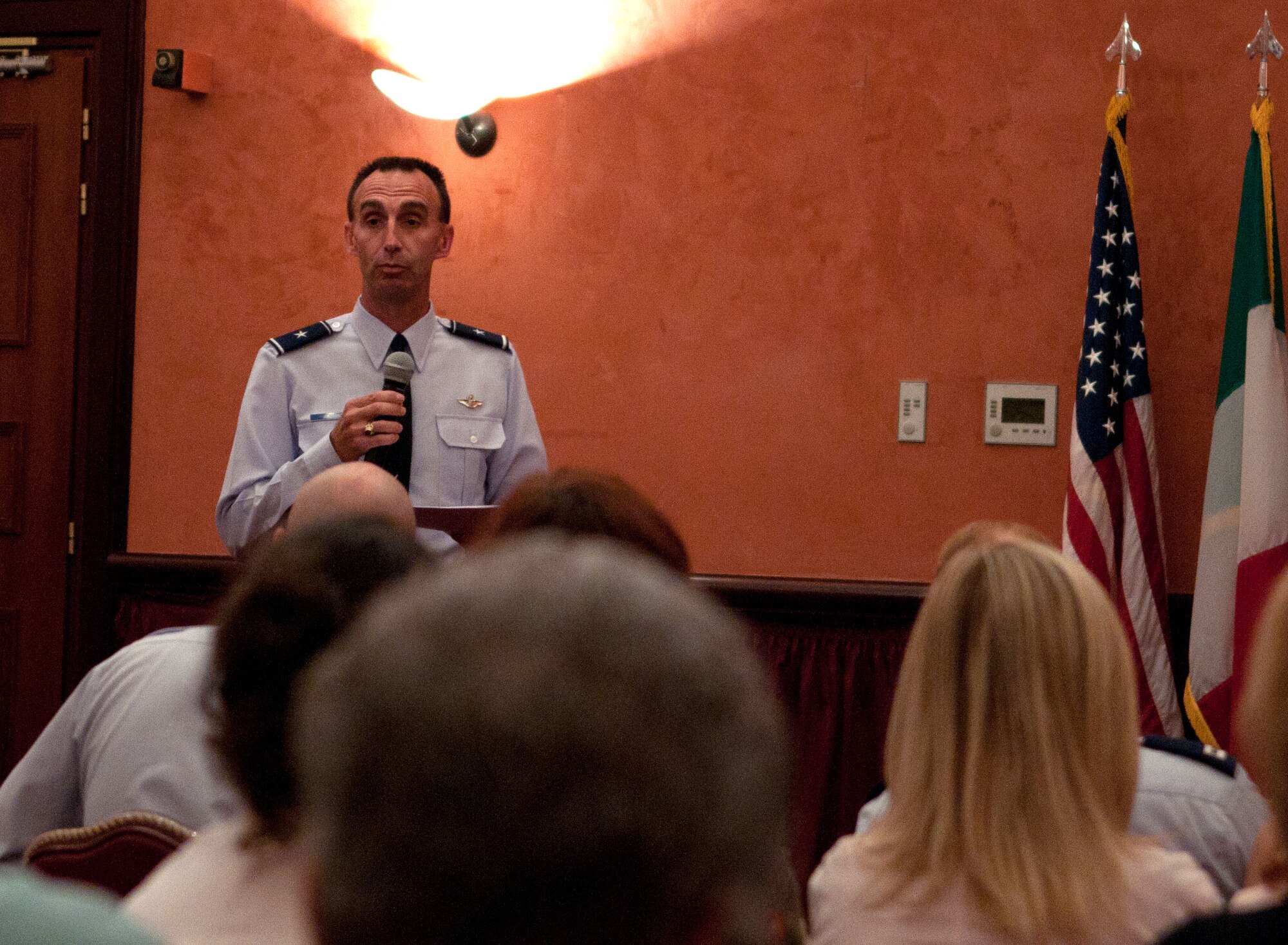 Brig. Gen. Scott Zobrist, 31st Fighter Wing commander, greets Team Aviano with surprising news at the Town Hall meeting Sept. 26 at La Bella Vista Club with the announcement of a major change to the 31st Fighter Wing's exercise and inspection schedule. General Zobrist announced the cancellation of the upcoming Operational Readiness Exercise in October because of the wing's demonstrated proficiency in their ability to generate aircraft and deploy the force. (U.S. Air Force photo/Staff Sgt. Justin Weaver)