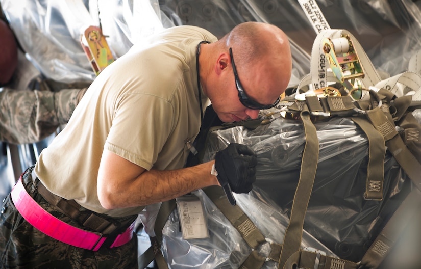 Staff Sgt. Nathan Dunn, 728th Air Mobility Squadron, pushes a pallet on a C-17 Globemaster III Oct. 3, 2011, at Incirlik Air Base, Turkey. Dunn is the first aerial port expeditor to reach 1,000 cargo loads. The APEX program allows cargo to be loaded onto aircraft without a loadmaster. (U.S. Air Force photo by Senior Airman Clayton Lenhardt/Released)