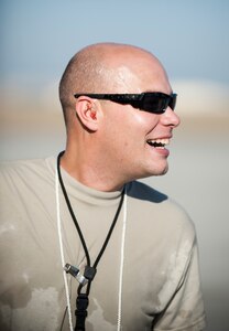 Staff Sgt. Nathan Dunn, 728th Air Mobility Squadron, celebrates his 1,000th load as an aerial port expeditor Oct. 3, 2011, at Incirlik Air Base, Turkey. Dunn is the first APEX Airman to reach this milestone. The APEX program allows cargo to be loaded onto aircraft without a loadmaster. (U.S. Air Force photo by Senior Airman Clayton Lenhardt/Released)