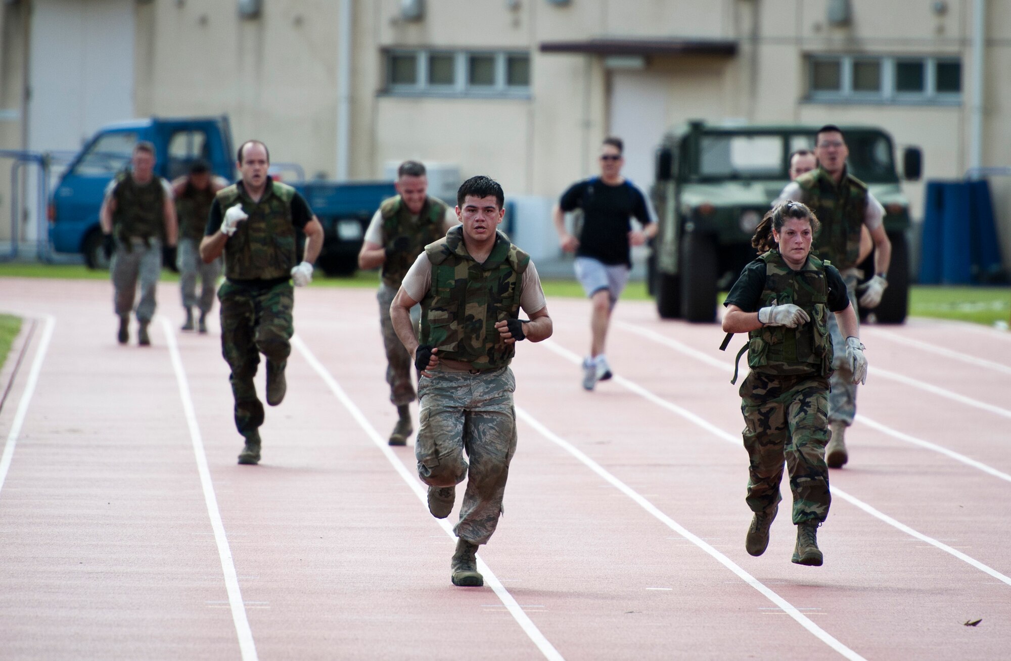 YOKOTA AIR BASE, Japan -- A team of Airmen from the 374th Medical Group sprint to the finish line during the Combat Endurance Challenge at Yokota Air Base, Japan, Oct. 1, 2011. The medical group took first place for the second year in a row. (U.S. Air Force photo/Staff Sgt. Samuel Morse)