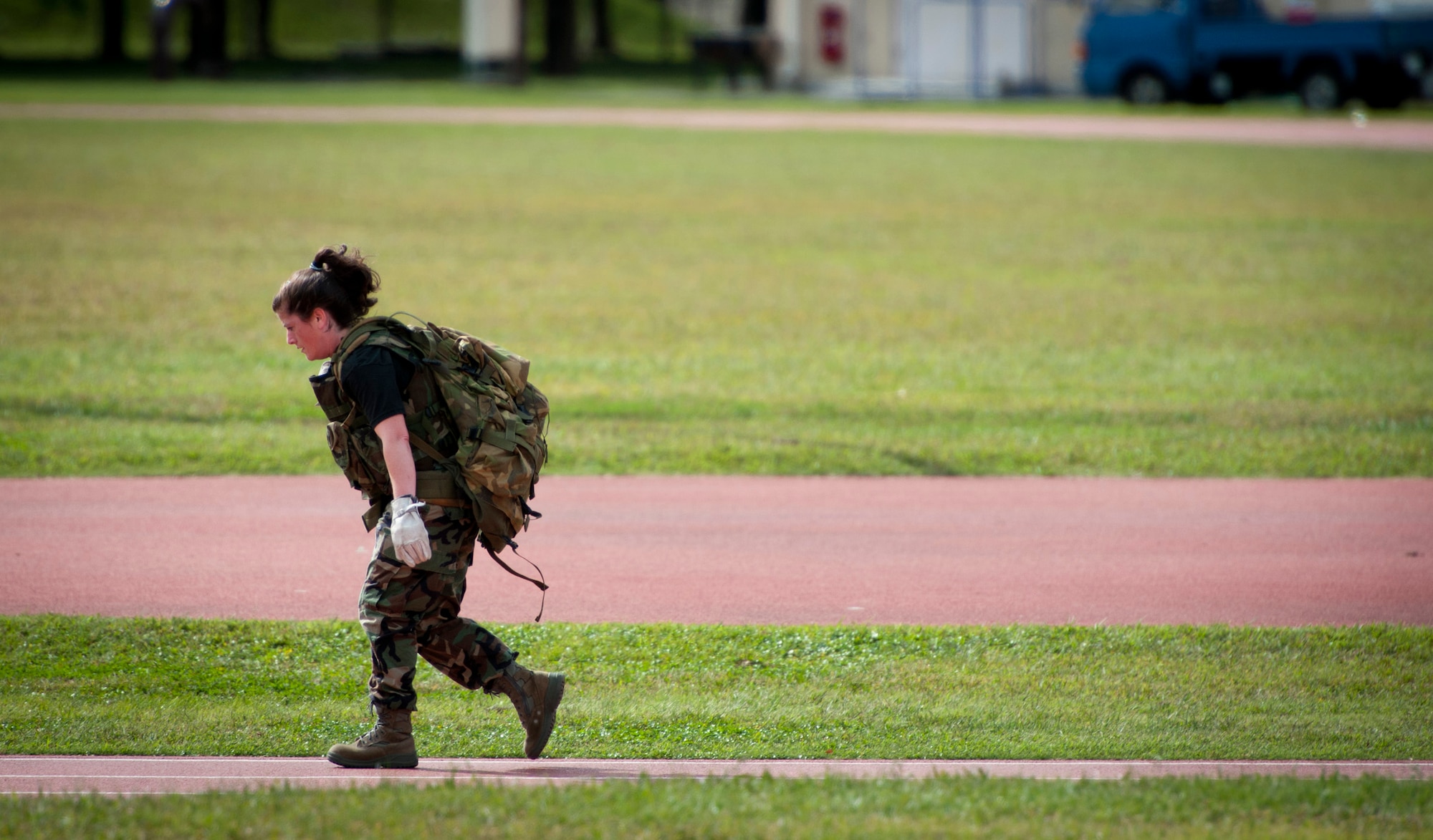 YOKOTA AIR BASE, Japan -- Capt. (Dr.) Suzanne Depaulo, 374th Medical Operations Squadron family medicine physician, carries a 60-pound rucksack around the high school track during the Combat Endurance Challenge at Yokota Air Base, Japan, Oct. 1, 2011. The 374th Medical Group team held regular practices during the two months leading up to the event to make sure each team member could keep up during the challenge. (U.S. Air Force photo/Staff Sgt. Samuel Morse)