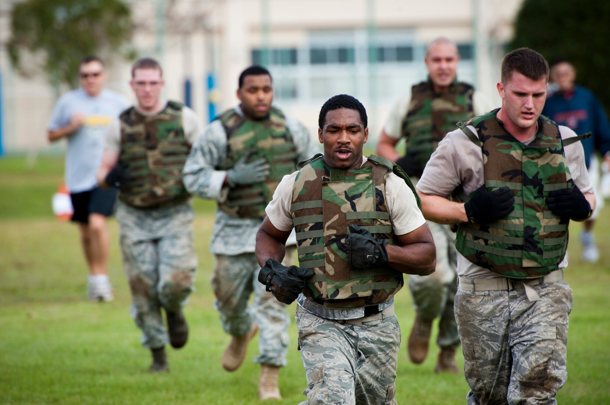 YOKOTA AIR BASE, Japan -- A team of Airmen from the 374th Maintenance Squadron propulsion flight runs to their next task during the Combat Endurance Challenge at Yokota Air Base, Japan, Oct. 1, 2011. The task locations were spaced apart from each other, forcing the weary teams to run to each station to avoid time penalties. (U.S. Air Force photo/Staff Sgt. Samuel Morse)
