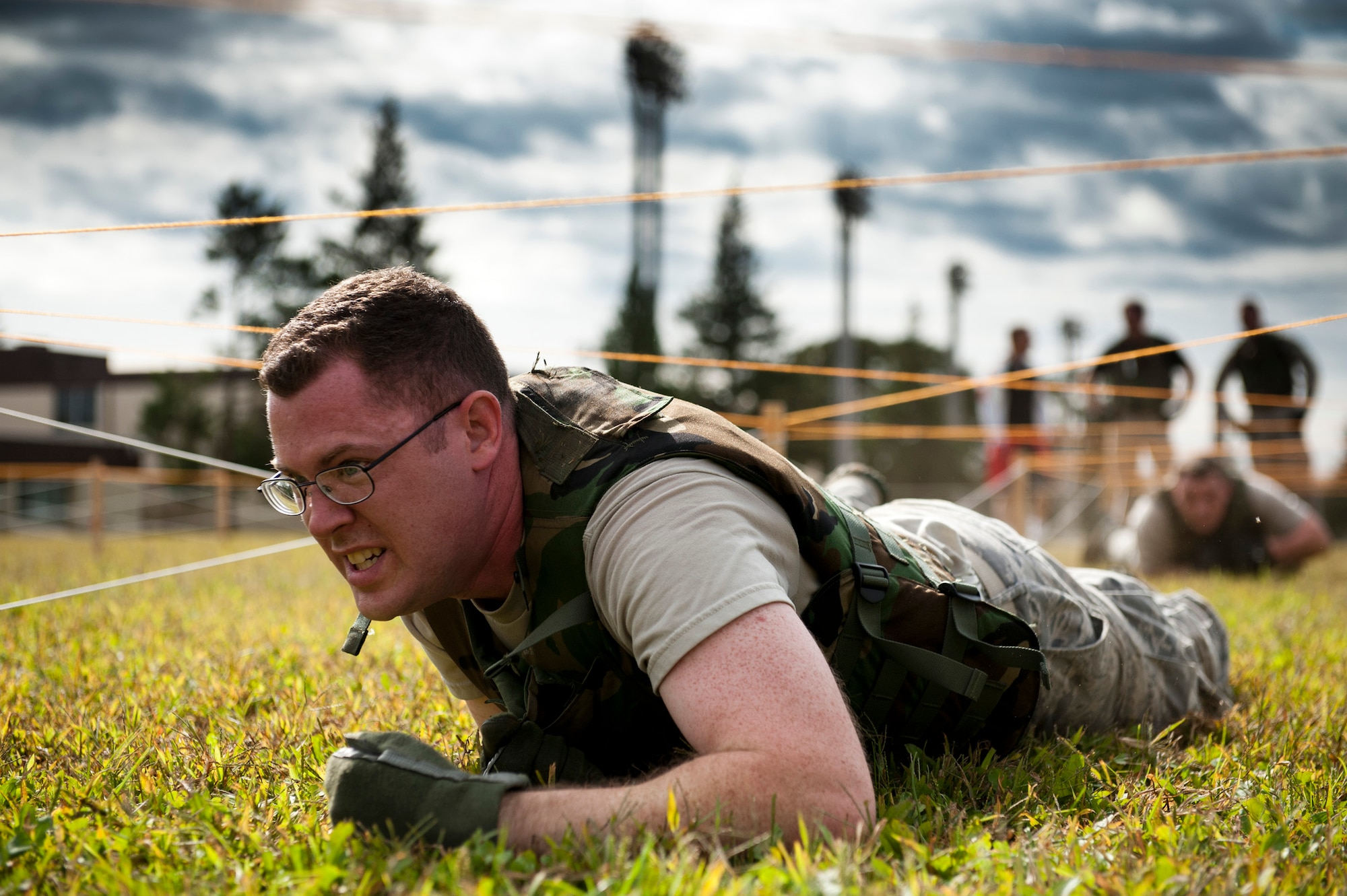 YOKOTA AIR BASE, Japan -- Staff Sgt. Paul Goldsmith, 730th Air Mobility Squadron Global Decision Support System II system administrator, performs a low-crawl during the Combat Endurance Challenge at Yokota Air Base, Japan, Oct. 1, 2011. The 730th AMS sponsored the event raising approximately $1,700 for the National September 11 Memorial. (U.S. Air Force photo/Staff Sgt. Samuel Morse)