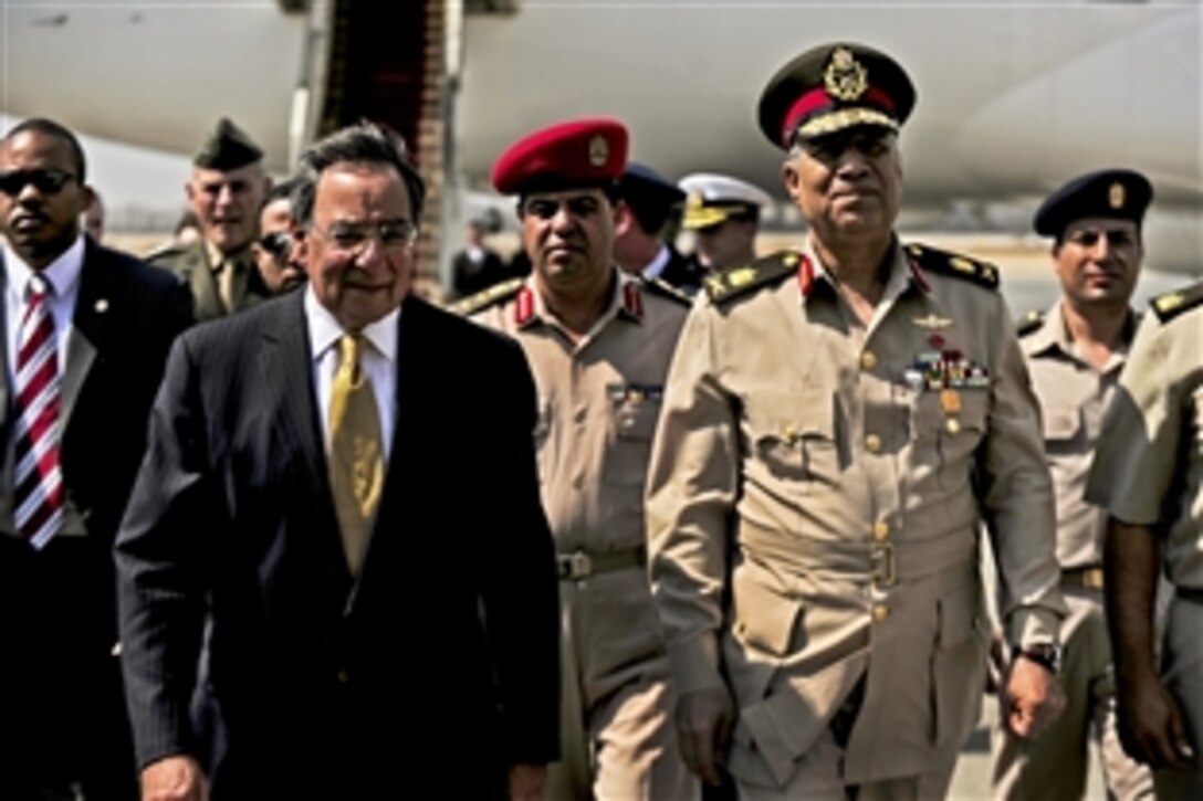 Egyptian Maj. Gen. Rouini greets U.S. Defense Secretary Leon E. Panetta upon arriving in Cairo, Oct. 4, 2011.