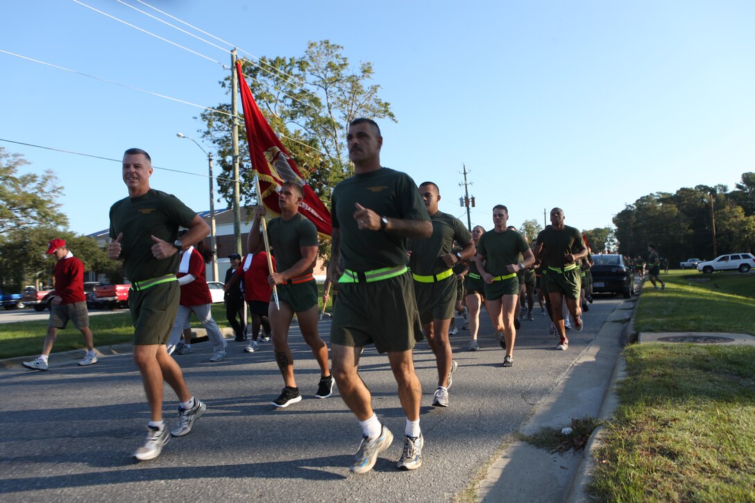 Marines and sailors with Headquarters and Support Battalion, Marine Corps Base Camp Lejeune run in the Combined Federal Campaign's 5K race aboard the base, Oct. 5. The run served as an awareness tool for the CFC to make people aware of the campaign's efforts in its 50th year in existence.