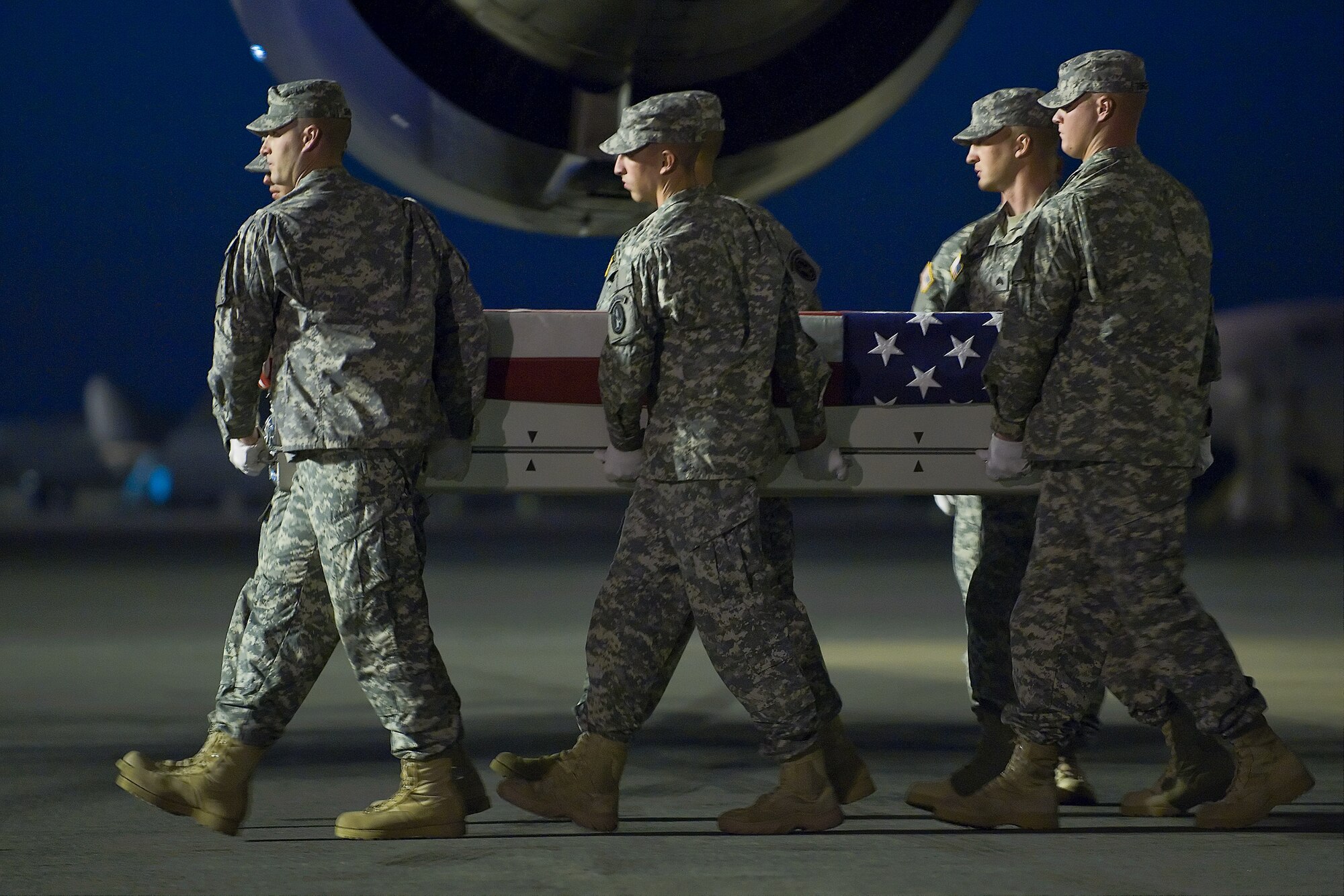 A U.S. Army carry team transfers the remains of Army Pvt. Danny Chen, of New York, at Dover Air Force Base, Del., Oct. 5, 2011. Chen  was assigned to 3rd Battalion, 21st Infantry Regiment, 1st Stryker Brigade Combat Team, 25th Infantry Division, Fort Wainwright, Alaska. (U.S. Air Force photo/Steve Kotecki)