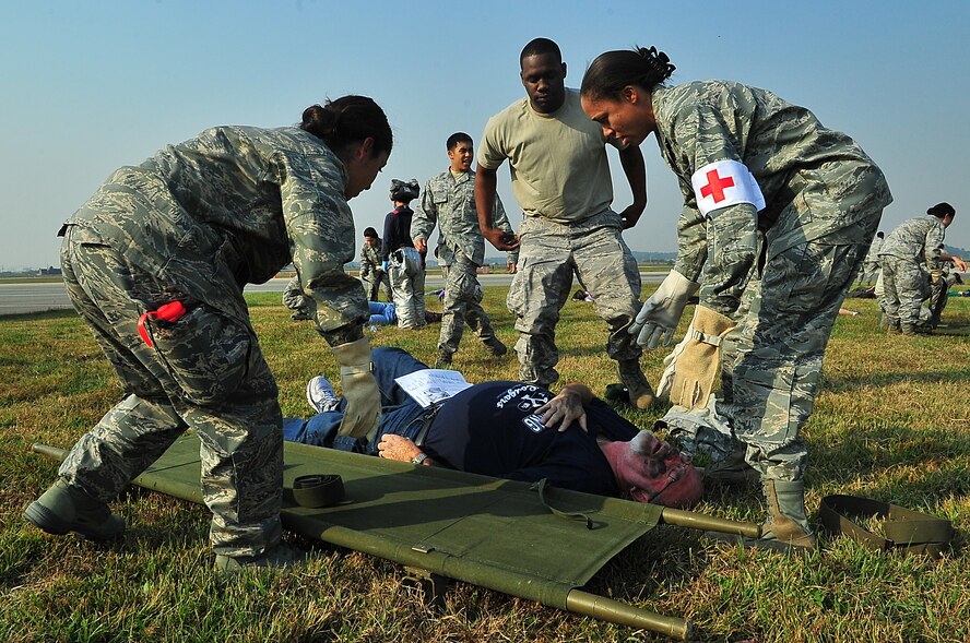 During an Emergency Management Exercise, Osan responders reacted to a simulated A-10 that collided with a CH-47, which then crashed into a static display during an airshow, here Oct. 5.  Fifth-graders from Osan Middle School helped with the exercise, giving it a 'real-feel'.  The students were moulaged up and spread across the flight-line serving as victims for first responders with wounds ranging from smoke inhalation to protruding insides.  This exercise gave Osan responders a chance to shine while responding to a very possible emergency scenario.  (U.S. Air Force Photo by/Staff Sgt. Daylena Gonzalez)