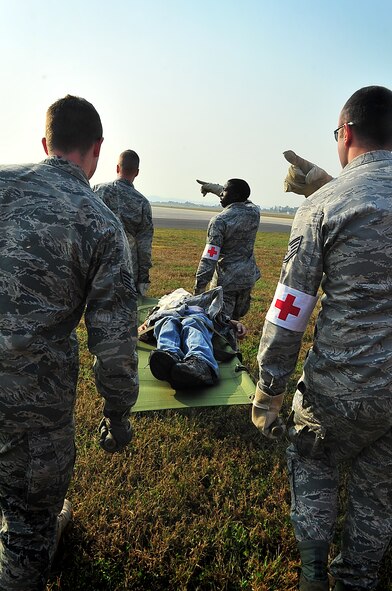 During an Emergency Management Exercise, Osan responders reacted to a simulated A-10 that collided with a CH-47, which then crashed into a static display during an airshow, here Oct. 5.  Fifth-graders from Osan Middle School helped with the exercise, giving it a 'real-feel'.  The students were moulaged up and spread across the flight-line serving as victims for first responders with wounds ranging from smoke inhalation to protruding insides.  This exercise gave Osan responders a chance to shine while responding to a very possible emergency scenario.  (U.S. Air Force Photo by/Staff Sgt. Daylena Gonzalez)