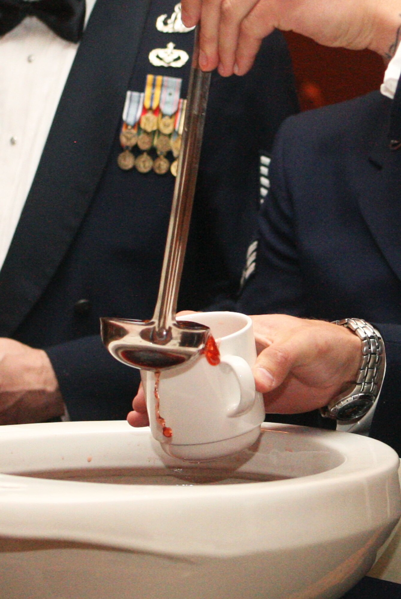 Members fill the grog cup at the 94th Airlift Wing Dining Out held in downtown Atlanta, Ga., Oct. 1. (U.S. Air Force photo/Don Peek)