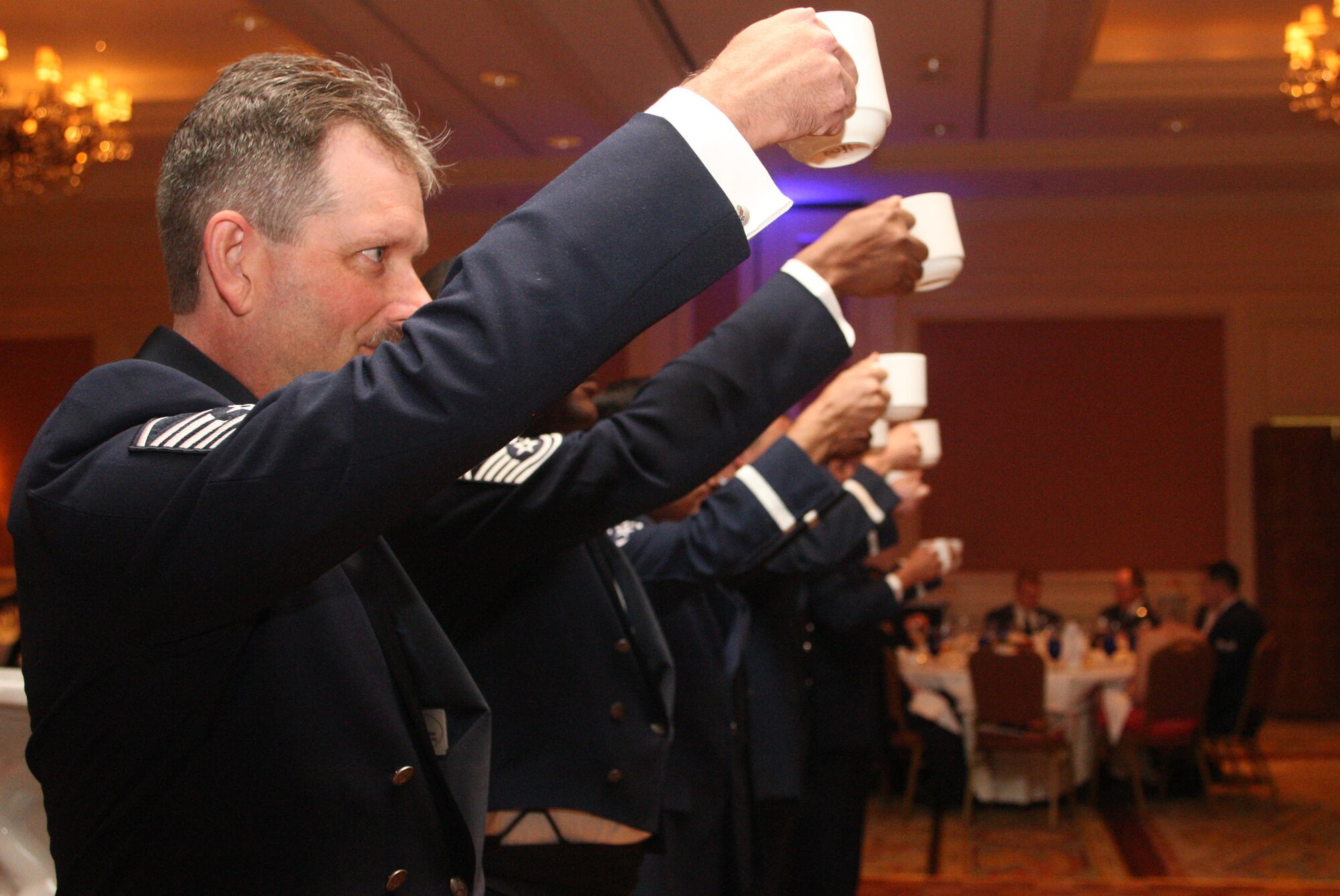 Members of the 94th Airlift Wing Honor Guard take their turn at the grog raising a cup "to the mess" at the 94th Airlift Wing Dining Out held in downtown Atlanta, Ga., Oct. 1. (U.S. Air Force photo/Don Peek)