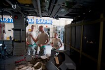 From left to right, U.S. Air Force Airman 1st Class Jeffery Cox, electrical and environmental systems apprentice, Airman 1st Class Joshua Jaynes, crew chief apprentice, and Senior Airman Sindy Keefe, engine troop, discuss maintenance while working on an HH-60G Pave Hawk Oct. 5, 2011, at Moody Air Force Base, Ga. All three Airmen are part of the 41st Helicopter Maintenance Unit. Although they are from different career fields, they often come together to conduct maintenance to ensure the aircraft is prepared for flight. (U.S. Air Force photo by Staff Sgt. Jamal D. Sutter/Released)