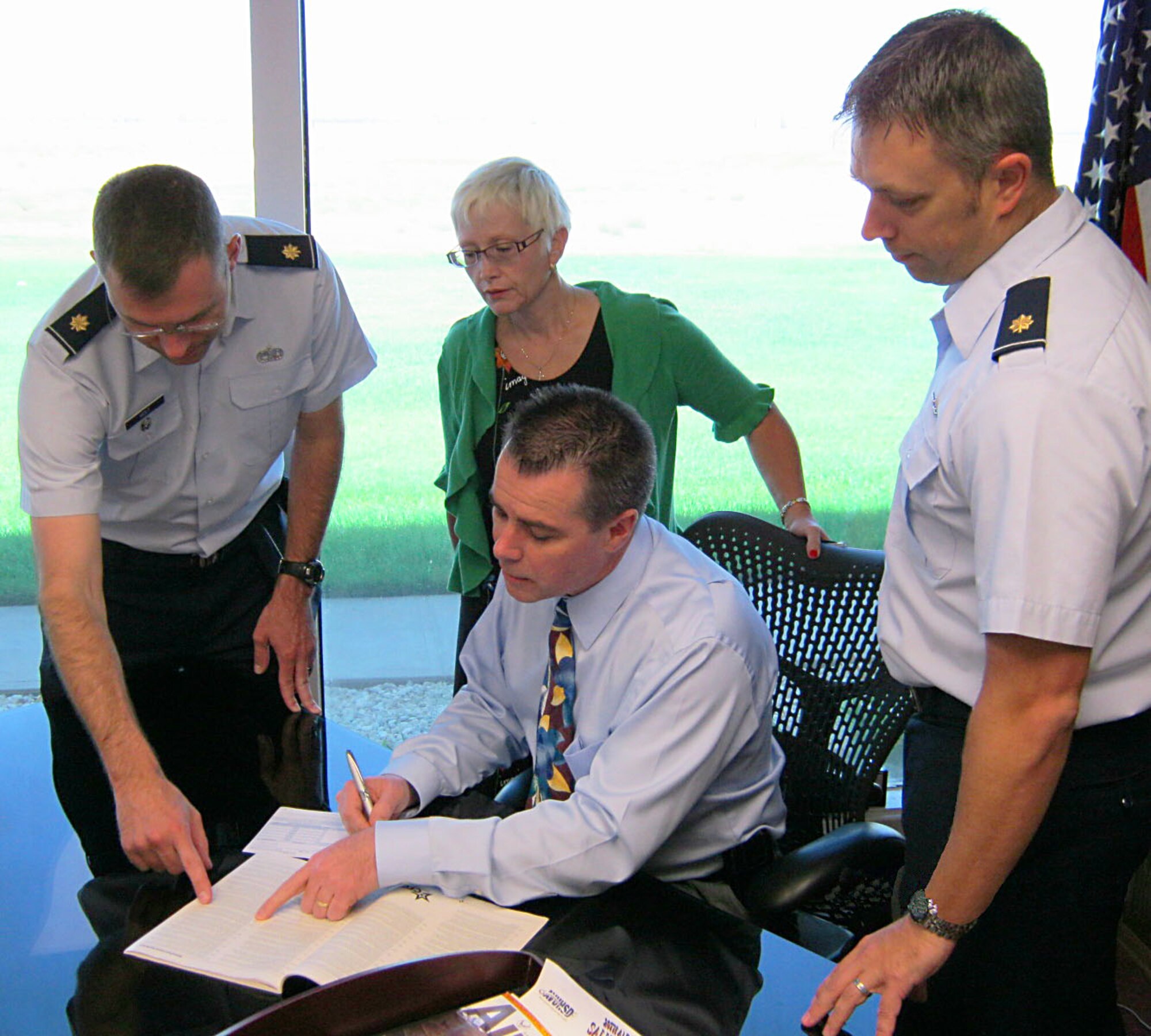 Total team effort is what the Combined Federal Campaign is all about. 

Mr. Timothy W. Hughes, acting director, Aeronautical Systems Center Detachment 1, leads his team in the annual CFC campaign Sept. 27. With assistance from CFC representatives, Major Chad Holt, AFOTEC Det. 5, Mrs. Dianna D. Condon, Executive Officer and CFC Coordinator, ASC Det 1, and Maj. Patrick Merriman, AFOTEC Det 5, Mr. Hughes ensures his contributions will go to charities he selects. (Courtesy Photo)
