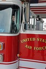 LAUGHLIN AIR FORCE BASE, Texas -- Maria Ramon, an honorary pilot for a day, rides around in a fire truck here Sept. 28. Maria is mentally challenged and was selected to receive an all access tour of Laughlin and had the opportunity to a pilot for a day. (U.S. Air Force photo/Senior Airman Scott Saldukas)