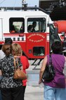 LAUGHLIN AIR FORCE BASE, Texas -- Maria Ramon, an honorary pilot for a day, rides around in a fire truck here Sept. 28. Maria is mentally challenged and was selected to receive an all access tour of Laughlin and had the opportunity to a pilot for a day. (U.S. Air Force photo/Senior Airman Scott Saldukas)